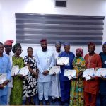 At the centre is the Managing Director Lagos Water Corporation Engr Mukhtaar Tijani next left is the Executive Director Operations Engr Mrs Omolanke Taiwo and the retirees with their Certificates of Service.