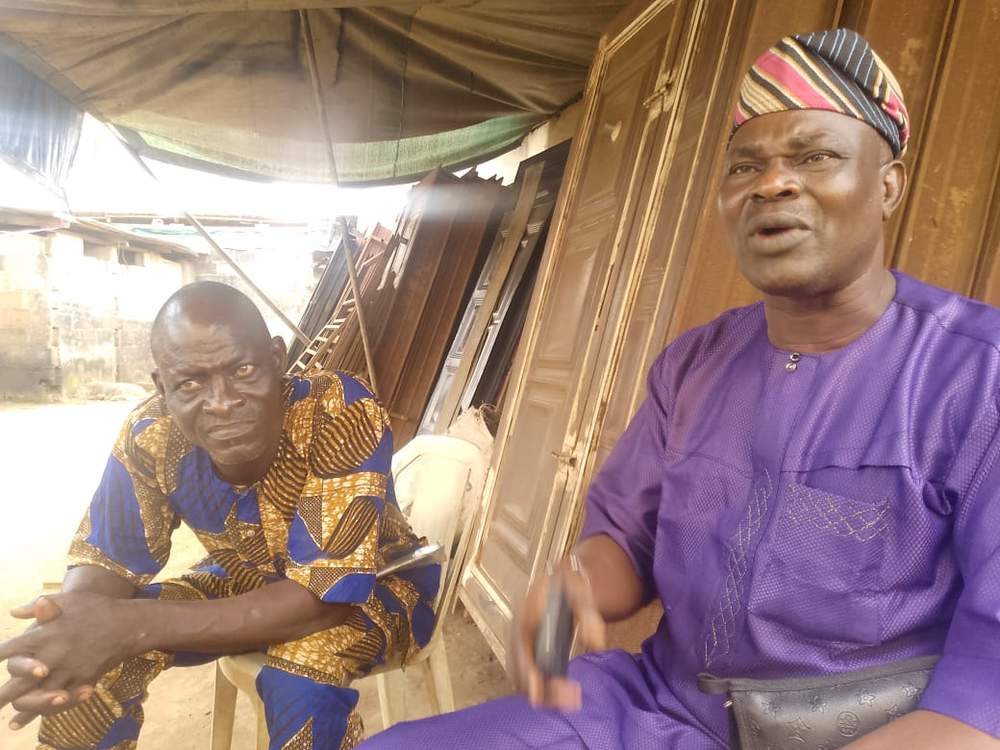 Mr. Shamu and one of his workers